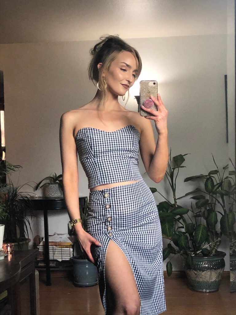 white woman taking a full length selfie wearing gingham two piece set